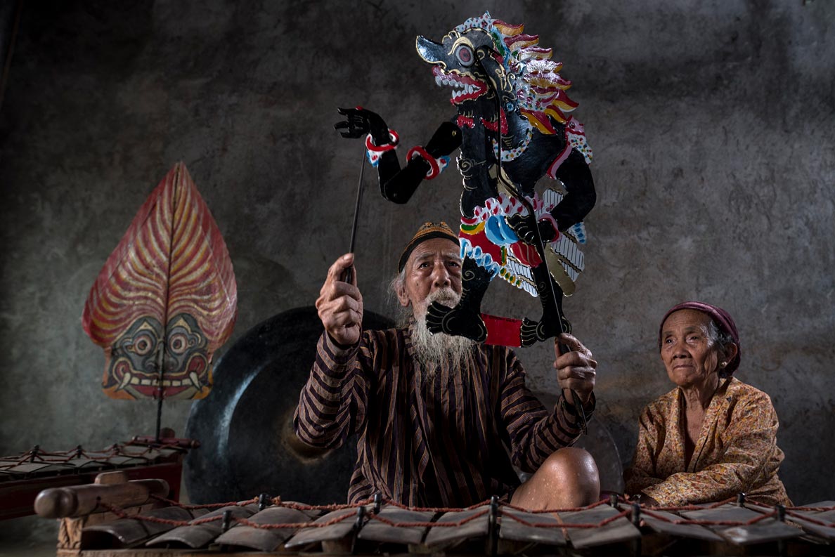The Dalang (puppeteer), Wayang Kulit puppet theater of Java, Indonesia