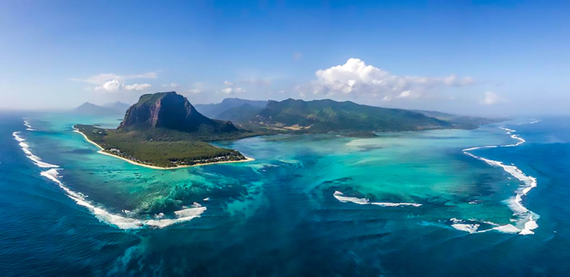 Aerial view of Mauritius' underwater waterfall with Le Morne Brabant mountain
