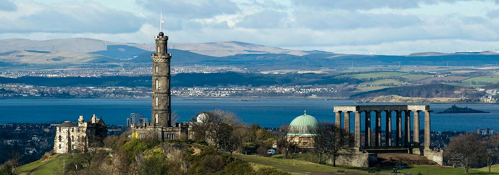 Calton Hill with the Old Observatory House, the Nelson Monument, the City Observatory, and the National Monument of Scotland, Edinburgh, Scotland, United Kingdom