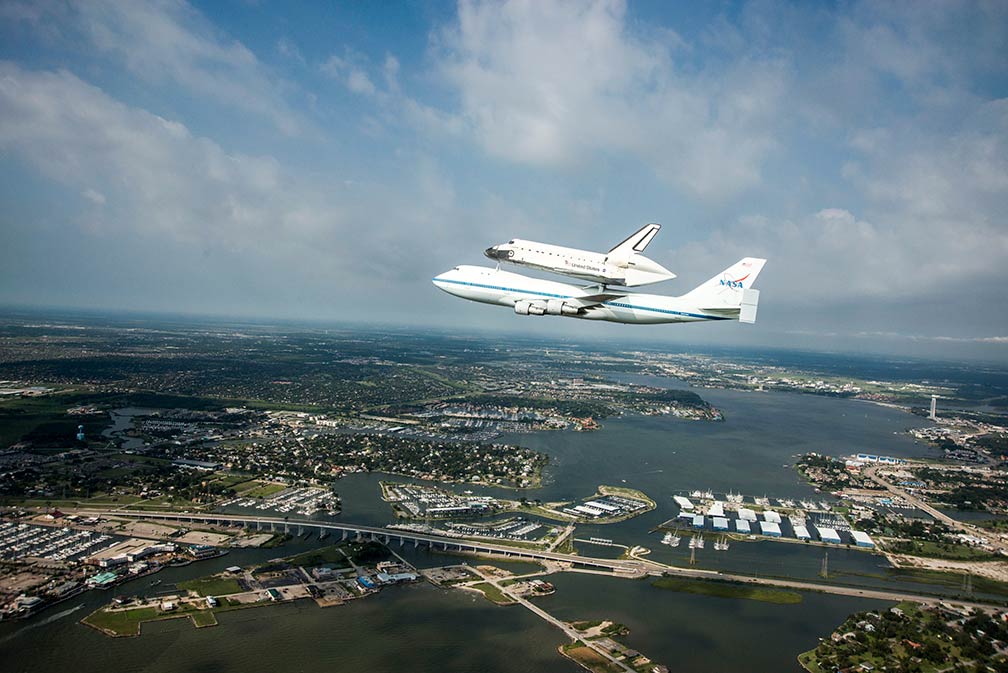 Space Shuttle Endeavour is ferried by NASA's Shuttle Carrier Aircraft over  Housten, Texas